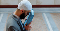 Kissing and wiping the Qur.aan over the eyes