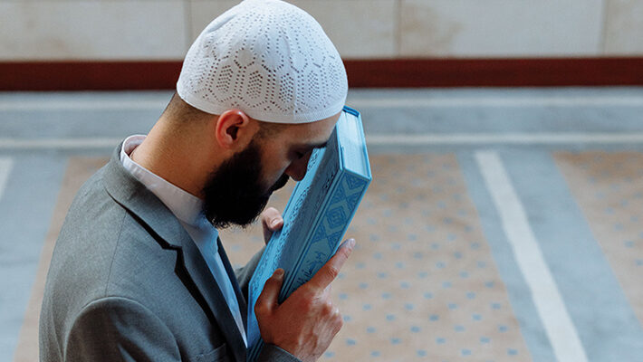 Kissing and wiping the Qur.aan over the eyes