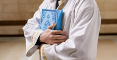 Reading the Qur.aan over the deceased and placing it on their stomach